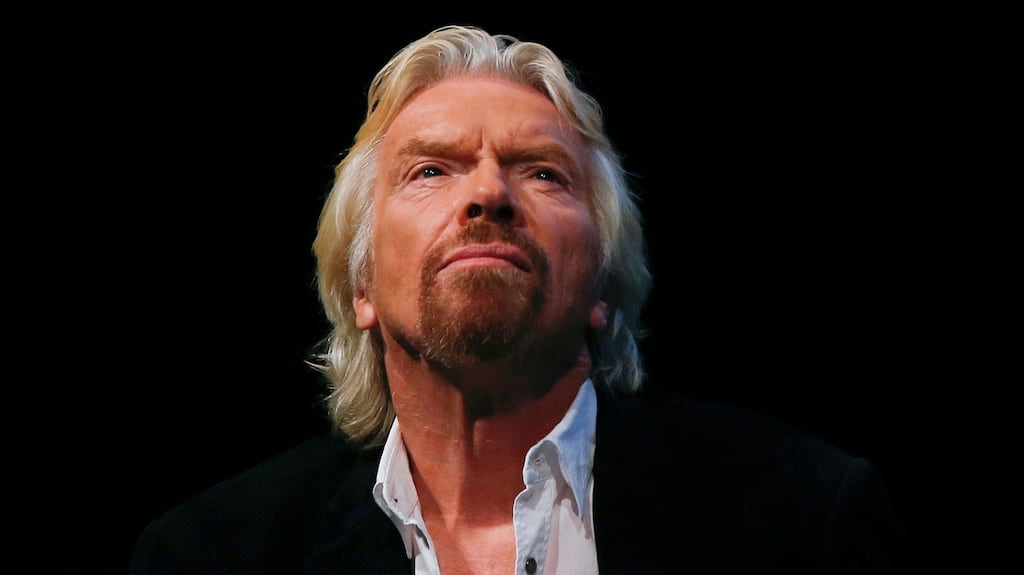 Richard Branson: while his behaviour is open and public and there is no suggestion he seeks to bully women, it does create images of beautiful young women in a working environment being bodily manhandled. Photograph: Shannon Stapleton/Reuters
