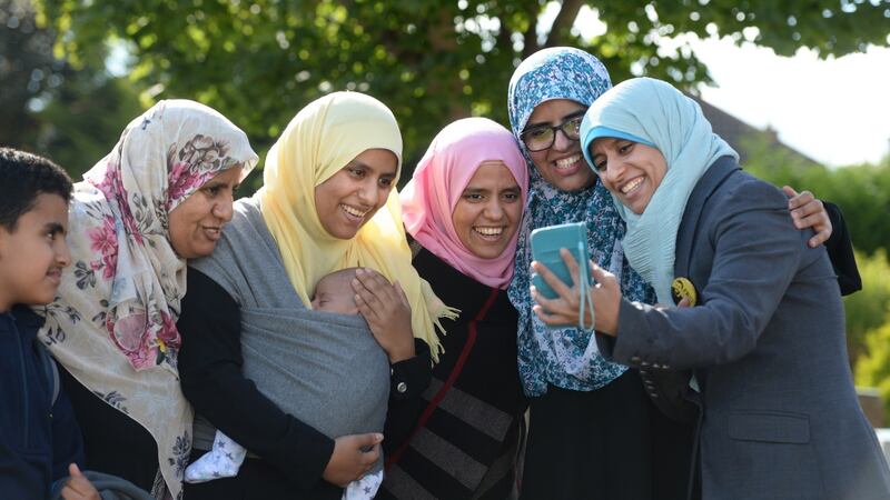 The Halawa family  celebrate at home in Firhouse, Dublin, after hearing news of their brother Ibrahim being acquitted of all charges. Photograph: Dara Mac Dónaill