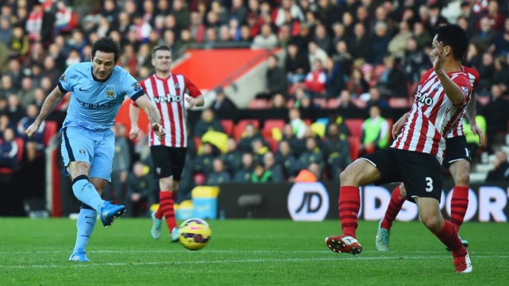 Frank Lampard of Manchester City shoots past Maya Yoshida of Southampton to score their second goal during the Premier League match at St Mary’s Stadium. Photograph: Shaun Botterill/Getty Images