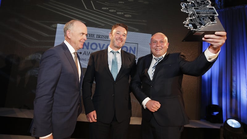 ‘Irish Times’ managing director Liam Kavanagh presents the overall Irish Times Innovation award to John Browne and Dr James Kennedy from Kastus at the Irish Times Innovation Awards last year. Photograph: Conor McCabe