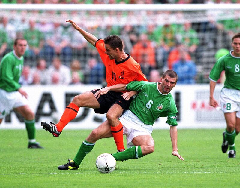 Roy Keane tackles Marc Overmars of Holland at Lansdowne Road in a crucial World Cup clash in 2001. Photograph: Billy Stickland/Inpho