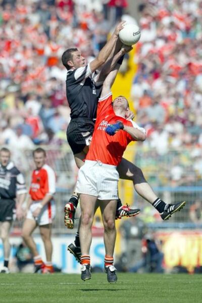 Sligo's Dara McGarty with Paul McGrane of Armagh