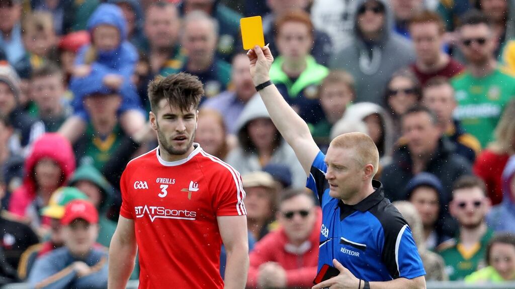 Louth’s Patrick Reilly is shown a yellow during his side’s defeat to Meath, a result which saw them drop into the qualifiers where they will play Longford. Photograph: Bryan Keane/Inpho