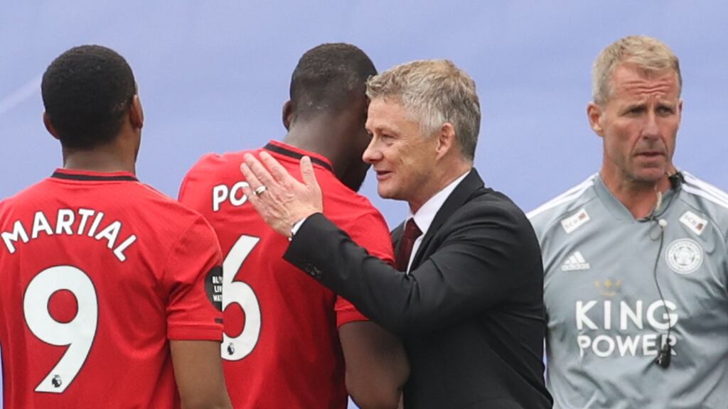 Manchester United manager Ole Gunnar Solskjaer congratulates Paul Pogba after their 2-0 Premier League win over Leicester City. Photo: Carl Recine/POOL/AFP via Getty Images