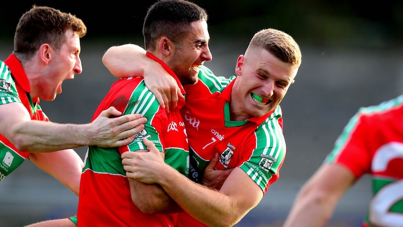 James McCarthy and Leon Young celebrate Ballymun’s win over Ballyboden in September. Photograph: Ryan Byrne/Inpho