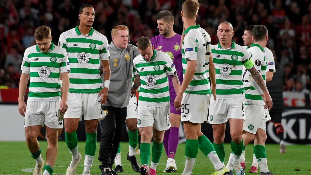 Celtic manager Neil Lennon congratulates his players at the end of the Europa League Group E match against Rennes at Roazhon Park stadium. Photograph: Sebastien Salom-Gomis/AFP/Getty Images