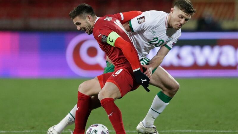 Dara O’Shea battles with Dusan Tadic during Ireland’s defeat to Serbia. Photograph: Andrej Cukic/EPA