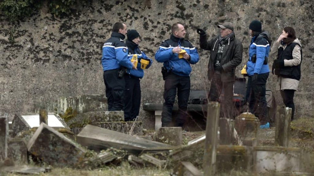 French gendarmes at the desecrated Jewish cemetery of Sarre-Union in France. Photograph: Frederick Florin/AFP/Getty