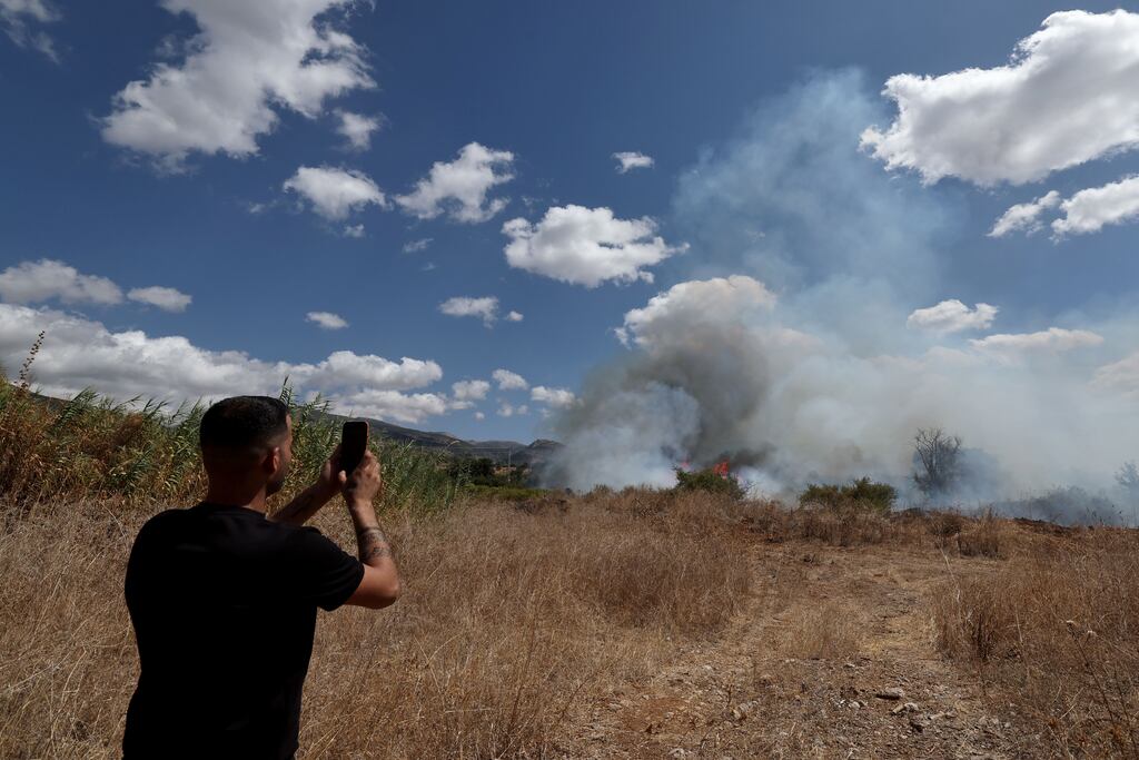 A fire burns where a projectile fell in the Upper Galilee, northern Israel, on Monday: Binyamin Netanyahu says what is needed is a 'fundamental change in the security situation in the north' to safely return displaced Israeli residents. Photograph: Atef Safadi