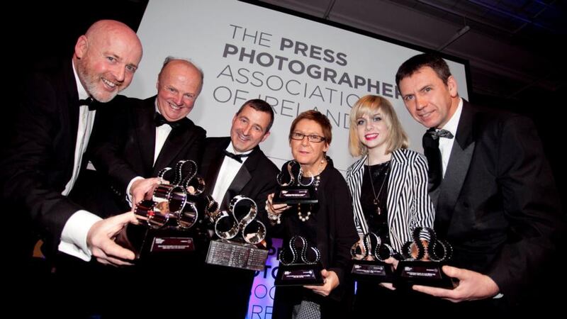 Irish Times photographers Bryan O’Brien, Eric Luke, Alan Betson, Brenda Fitzsimons, Judith Eileen Sleator- who accepted an award on behalf of her father, the late David Sleator - and Dara MacDonaill at thePress Photographer of the Year Awards which took place in Dublin. Photograph: Chris Bellew/Fennells