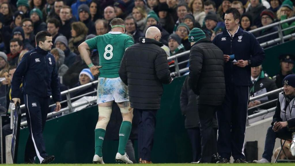 Ireland’s Jamie Heaslip goes off injured during the 18-11 win over France. Photograph: Ryan Byrne / Inpho