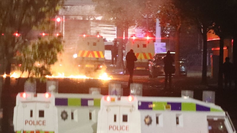 Missiles and fireworks being thrown at police on Lanark Way in the loyalist Shankill Road area close to the peace wall. Photograph: Brian Lawless/PA Wire