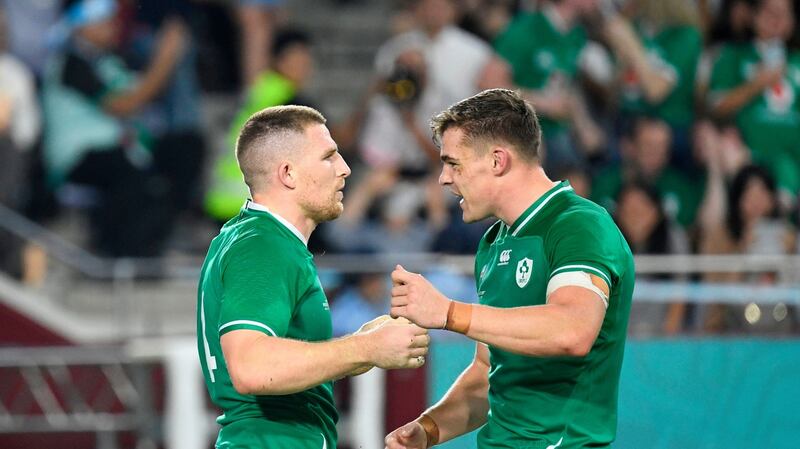 Andrew Conway celebrates with Garry Ringrose after scoring the fourth try. Photograph: Getty Images
