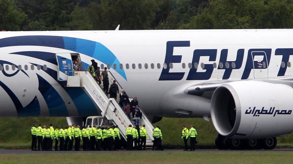 Passengers leaving the EgyptAir flight after it was diverted to Prestwick Airport, Scotland, today. Photograph: PA/Andrew Milligan Wire.