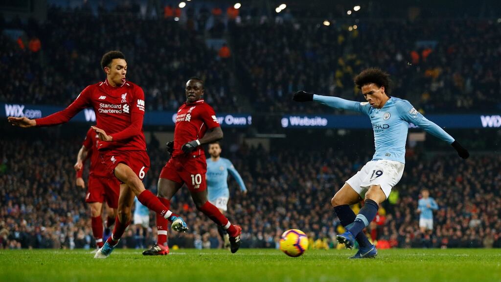 Manchester City’s Leroy Sané scores their second goal during the Premier League match against Liverpool at the Etihad Stadium. Photograph: Phil Noble/Reuters