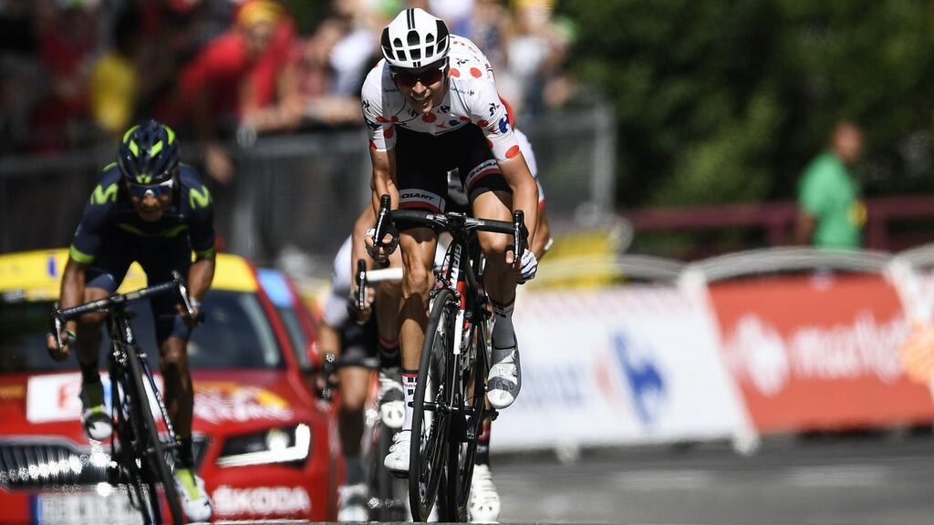 France’s Warren Barguil, wearing the best climber’s polka dot jersey, rides towards the finish line ahead of Colombia’s Nairo Quintana at the end of 13th stage of the Tour de France. Photograph: Lionel Bonaventure/AFP/Getty Images