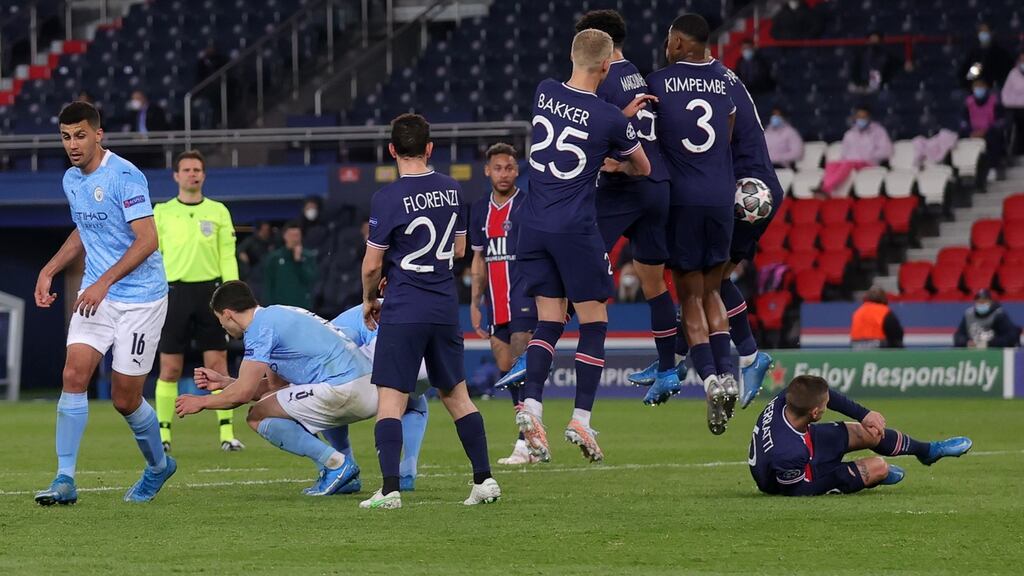 The Paris Saint-Germain wall parts as Riyad Mahrez’s free-kick finds its way through to give Manchester City a 2-1 win in their Champions League semi-final first leg. Photo: Alex Grimm/Getty Images