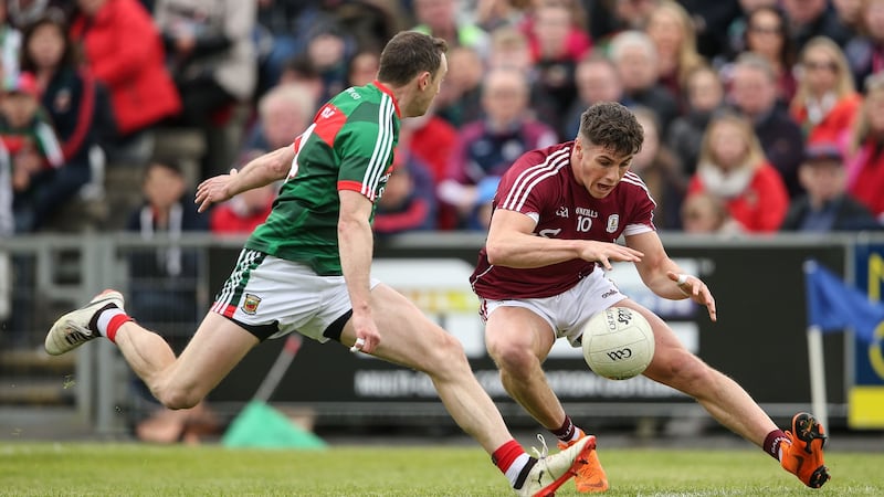 Galway’s Shane Walsh is challenged by Mayo’s Keith Higgins during the Connacht SFC quarter-final at Elvery’s McHale Park in Castlebar. Photograph: Cathal Noonan/Inpho