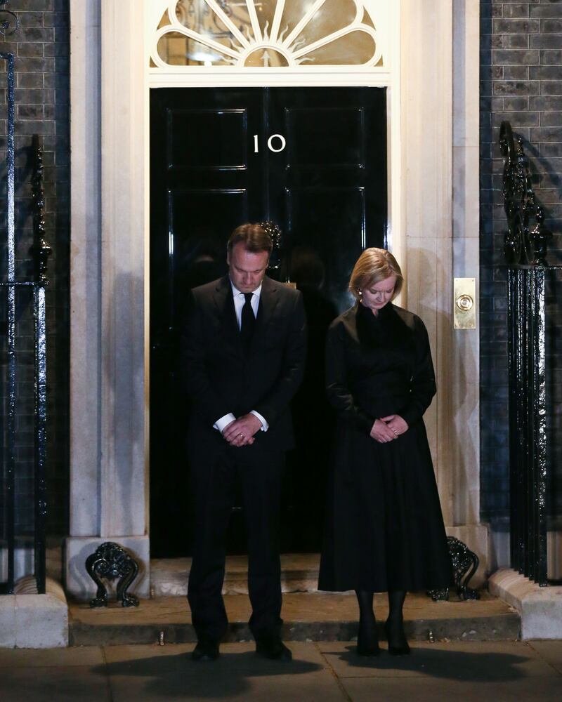 British PM Liz Truss and her husband Hugh O'Leary observe a minute of silence for Queen Elizabeth II in Downing Street. Photograph: Adam Vaughan/EPA-EFE