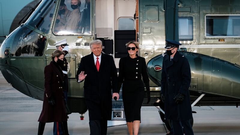 Donald and Melania Trump head towards Air Force One for the last time. Photograph: Pete Marovich/The New York Times