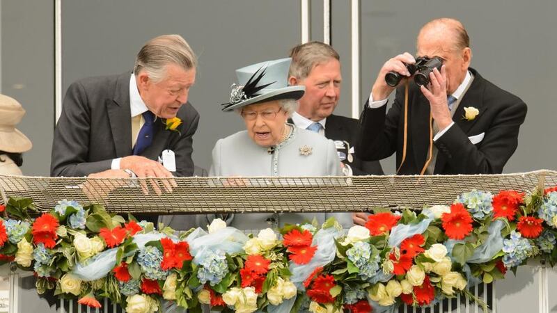 Queen Elizabeth II and the Duke of Edinburgh (right) during Derby Day at Epsom Downs Racecourse, Surrey. Photograph: Dominic Lipinski/PA Wire