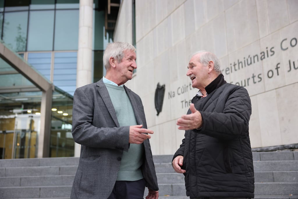 Retirees Noel Donohue and Tony Nolan outside the Criminal Courts of Justice in Dublin. Photograph: Dara Mac Dónaill