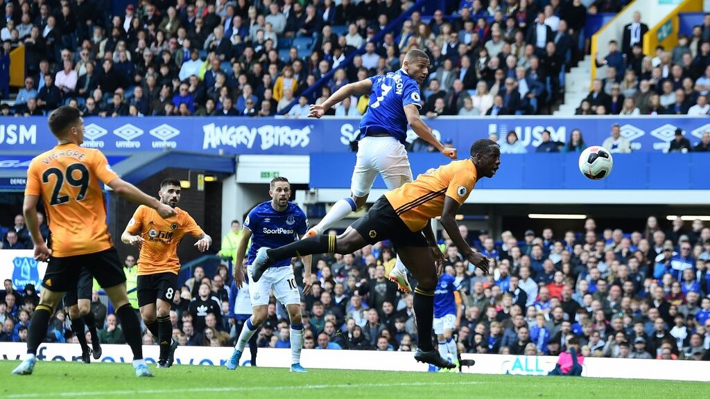 Richarlison leaps to score Everton’s winner against Wolves. Photograph: Nathan Stirk/Getty