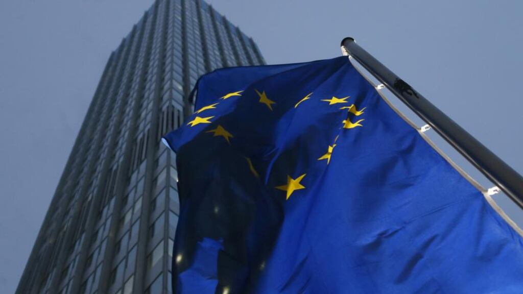 A European Union flag flies outside the European Central Bank (ECB) headquarters in Frankfurt, Germany. The European Central Bank plans to charge lenders as much as ¤15 million a year in supervisory fees. Photograph: Ralph Orlowski/Bloomberg