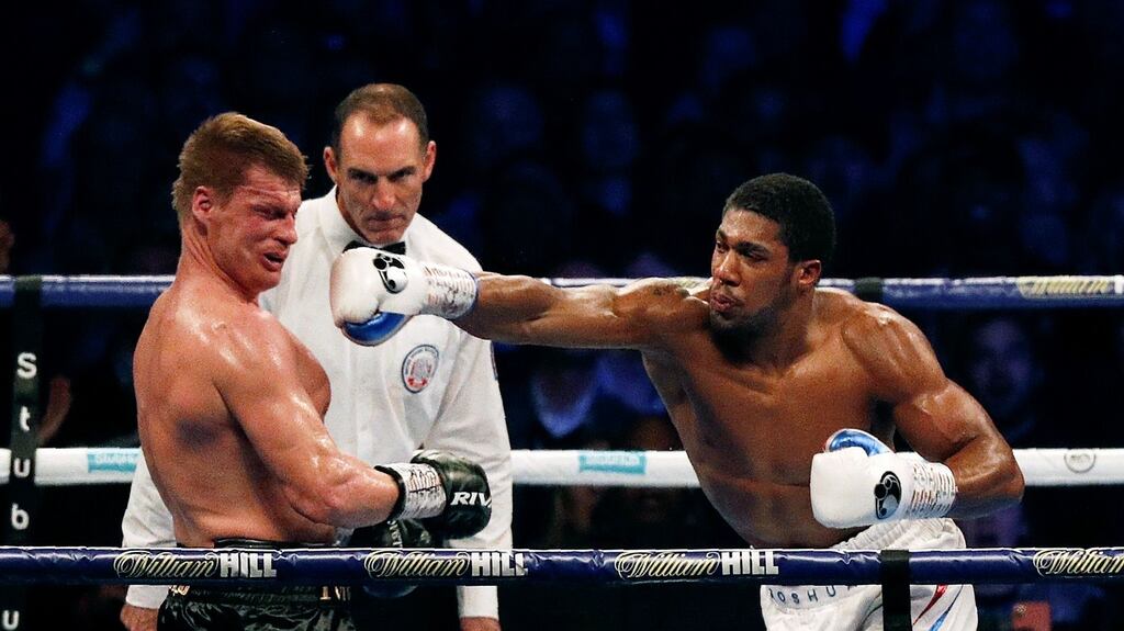 Alexander Povetkin is knocked down by Anthony Joshua in the seventh round of their world heavyweight title fight at Wembley Stadium. Photograph: Getty Images