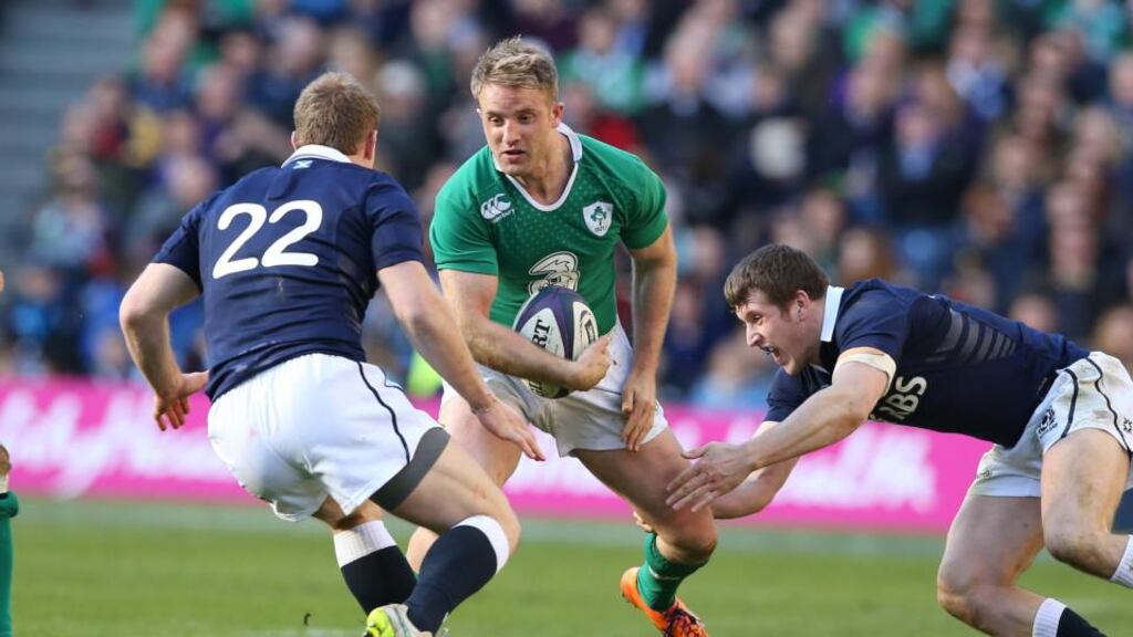 Luke Fitzgerald takes on the Scotland defence at Murrayfield, Edinburgh. Photograph: Billy Stickland/Inpho