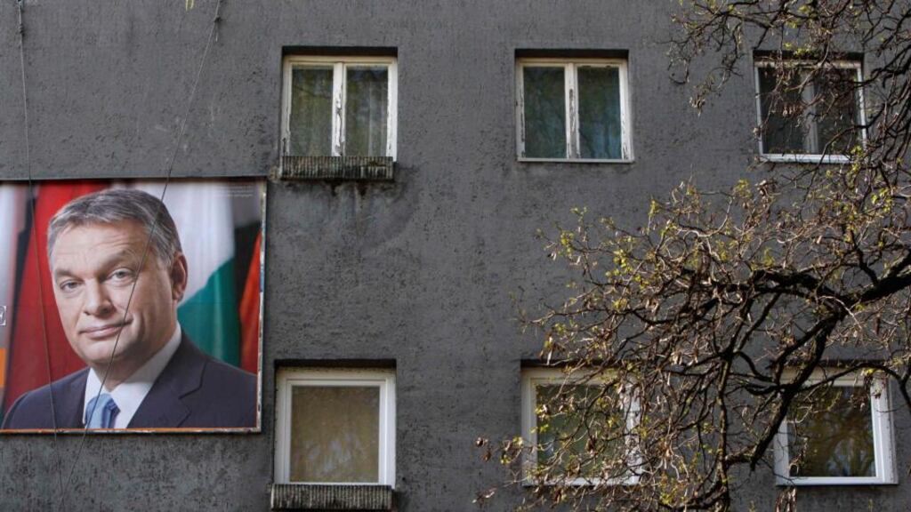 An election poster of Hungarian prime minister Viktor Orban on a residential building in Budapest. Hungarians vote in a parliamentary election today that is set to return Mr Orban into power for another four years. Photograph: Bernadette Szabo/Reuters