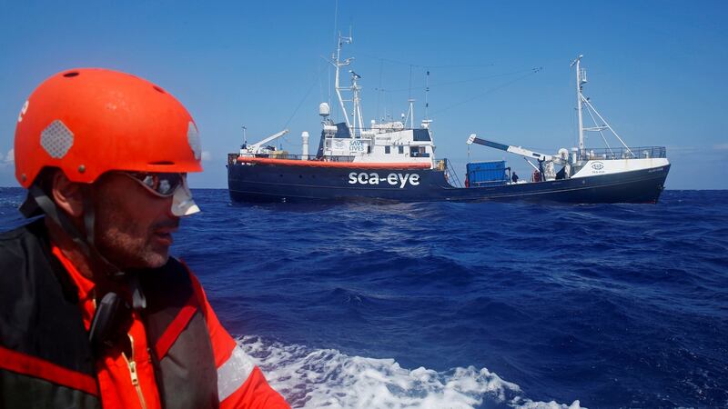 A crew member of the German NGO Sea-Eye migrant rescue ship Alan Kurdi takes part in a training exercise while on their way to the search and rescue zone in the western Mediterranean Sea. Photograph: Reuters/Darrin Zammit Lupi