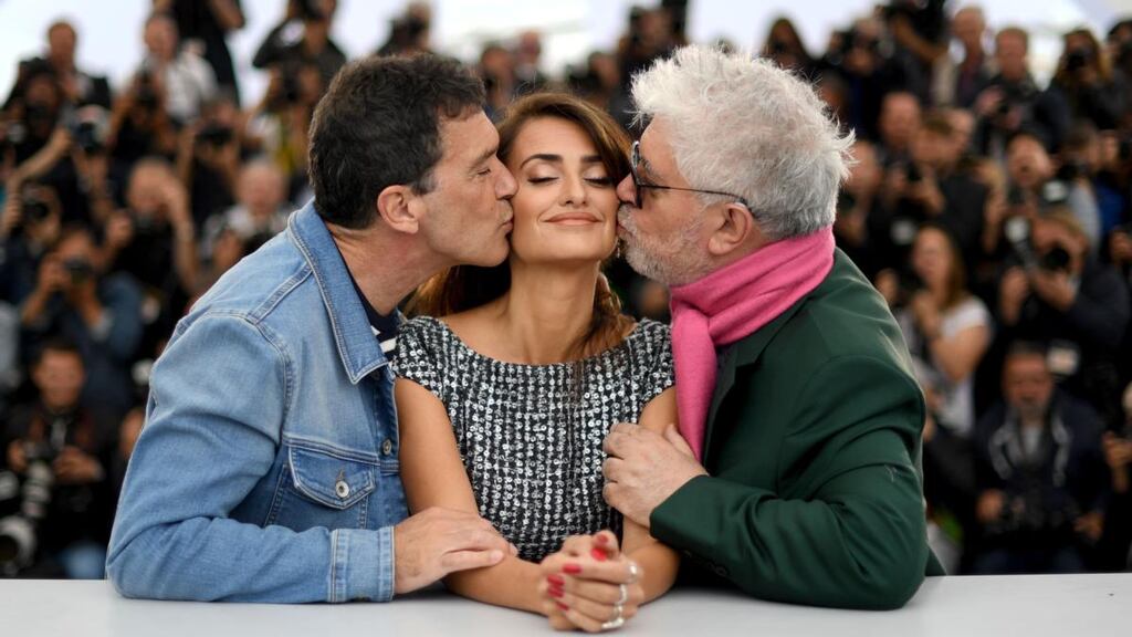 Cannes 2019: Antonio Banderas and Pedro Almodóvar kiss Penélope Cruz at a Pain and Glory photocall. Photograph: Loïc Venance/AFP/Getty