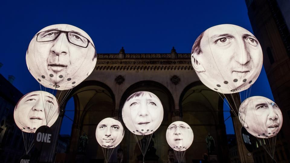 Life in politics: Angela Merkel’s face with those of other G7 leaders on ballons at a protest in Munich in June. Photograph: Joerg Koch/Getty