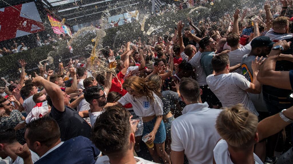Fans celebrate after England scored their second goal in the World Cup quarter-final against Sweden at Croydon Boxpark in London. Photograph: Chris J Ratcliffe/Getty Images