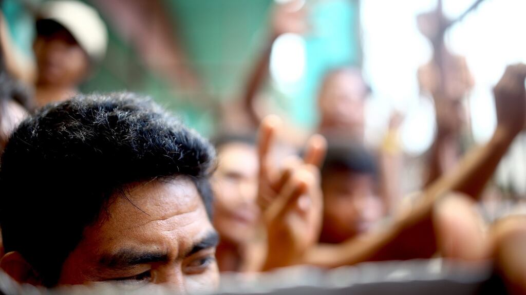 Inmates are seen at a prison facility in the Philippines where detainees reportedly escaped, in Kidapawan City, North Cotabato province on Wednesday. Photograph: Althea Ballentes/EPA