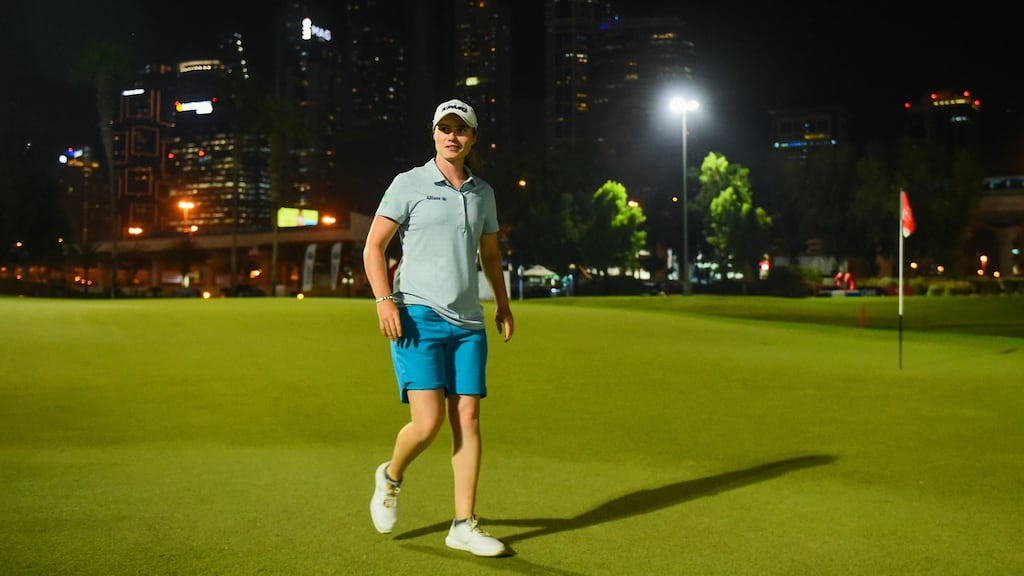 Leona Maguire of Ireland smiles after her last putt on day one of the Omega Dubai Moonlight Classic at Emirates Golf Club. Photograph: Tom Dulat/Getty Images
