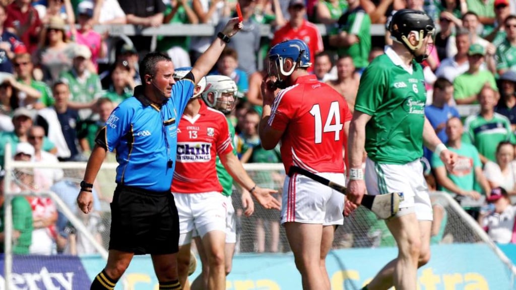Referee James McGrath sends off Cork’s Patrick Horgan during the Munster SHC Final against Limerick at the Gaelic Grounds. Photograph: James Crombie/Inpho