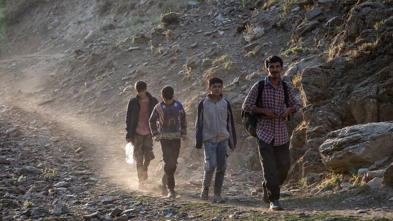Migrants from Afghanistan walk along a mountain pathway in Turkey on July 17th en route to Tatvan city. Photograph: Chris McGrath/Getty Images