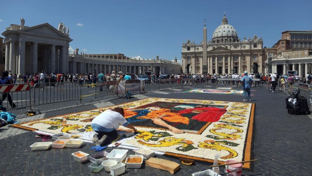 A flower mosaic is created in Saint Peter’s Square at the Vatican. The director and deputy director of the Vatican’s bank have resigned following the arrest of a senior cleric with close connections to the bank who is accused of plotting to smuggle €20 million into Italy from Switzerland. Photograph: Franco Origlia/Getty Images