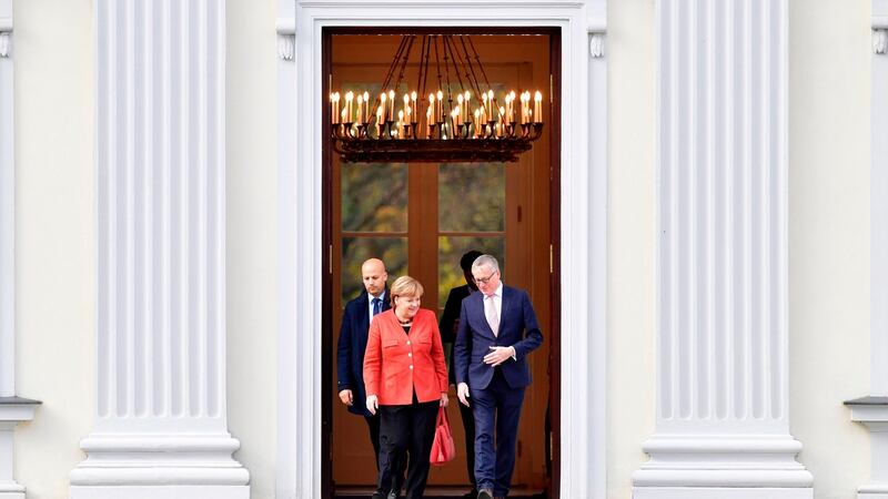 German Chancellor Angela Merkel leaves the presidential residence Bellevue Castle in Berlin where she met the German president after coalition talks failed overnight. Photograph: John MacDougall/AFP/Getty Images