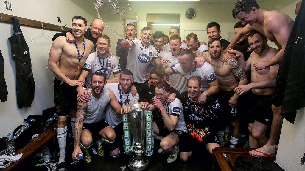 Dundalk players celebrate in the dressing room after receiving the Premier Division trophy at Oriel Park. Photo: Donall Farmer/Inpho