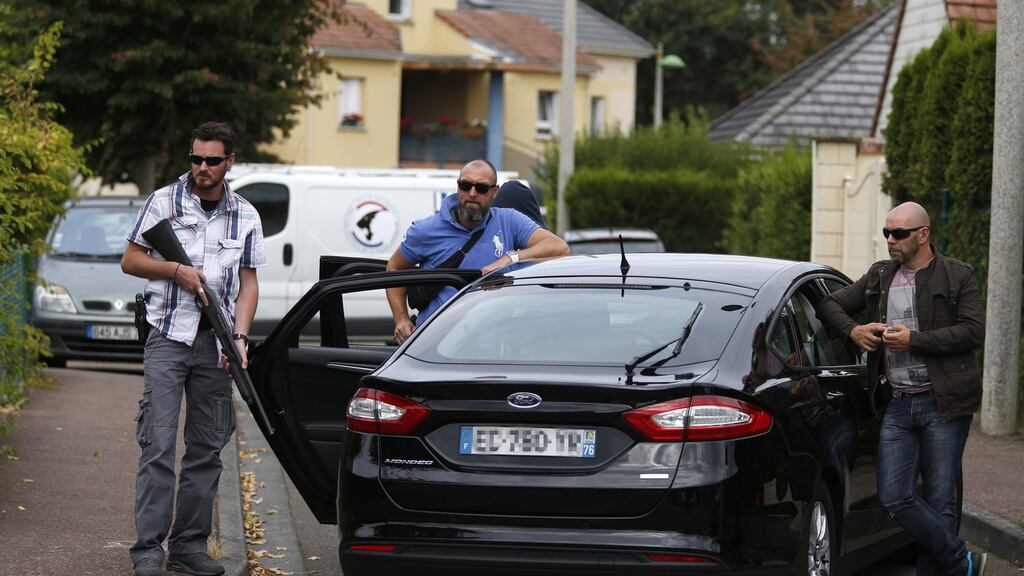 French policemen in the Normandy village of Saint-Étienne-du-Rouvray after a priest was killed in the latest of a string of attacks against Western targets claimed by or blamed on the Islamic State jihadist group. Photograph: Matthieu Alexandre/AFP/Getty Images