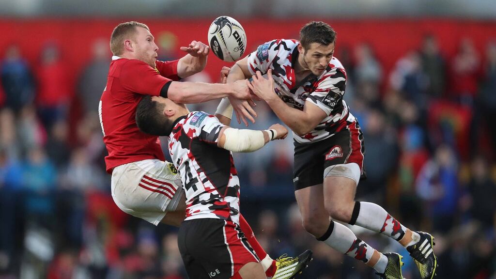 Munster’s Keith Earls contests the ball with with Edinburgh’s Damien Hoyland and Jason Tovey during the Guiness pro 12 game at Musgrave Park. Photograph: Billy Stickland/Inpho