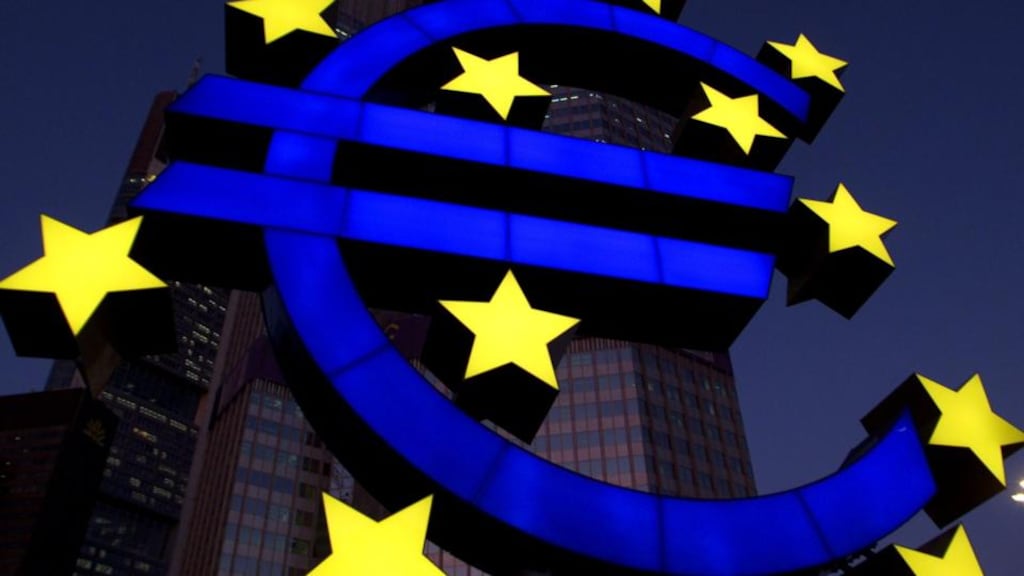 A huge sculpture of the euro symbol is illuminated in front of the ECB headquarters in Frankfurt. Photo: Reuters