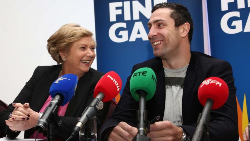 Former Olympic boxer Kenneth Egan, with Minister for Children Frances Fitzgerald. Egan revealed that Fitzgerald told him he didn’t “really need to know about politics” to run for election. Photograph: Colin Keegan/Collins