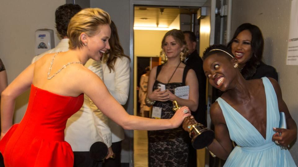 Behind the scenes: Jennifer Lawrence and Lupita Nyong’o backstage in 2014. Photograph: Christopher Polk/Getty