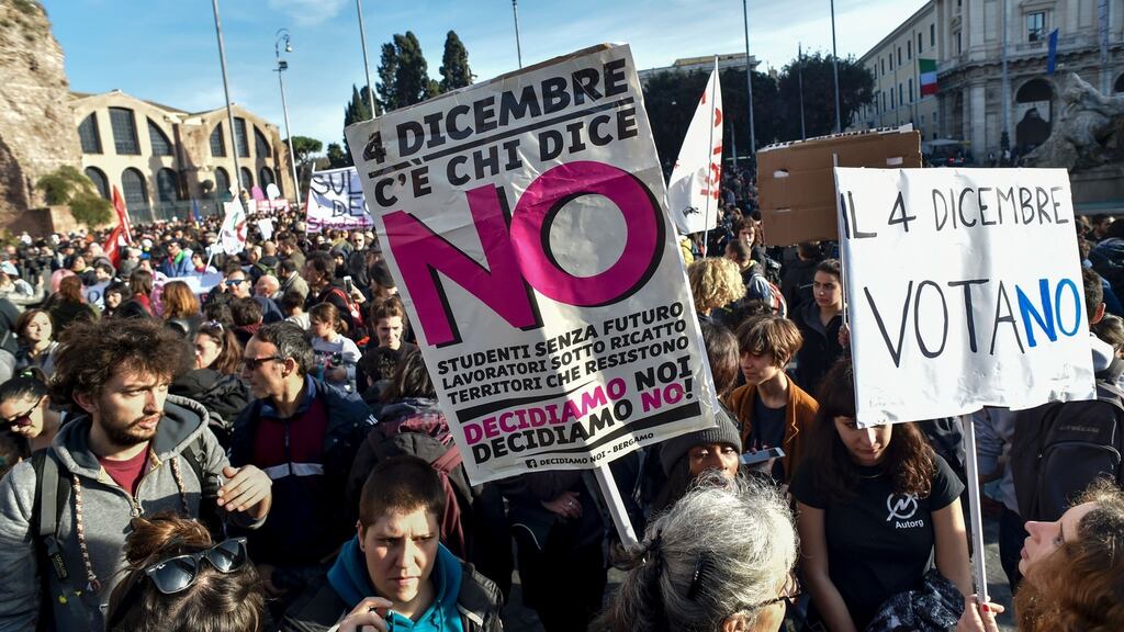 Demonstrators hold banners during a demonstration of the “C’e chi dice no” (some say no) movement calling for a “no” vote to the Italian referendum on constitutional reform which took place earlier this month. The referendum was rejected which led to the resignation of Italian prime minister Matteo Renzi. Photograph: AFP/Getty Images