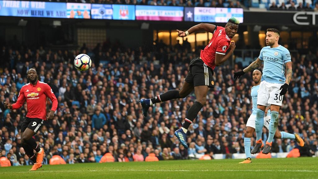 Paul Pogba heads home his and Manchester United’s second goal during the Premier League match against Manchester City at Etihad Stadium. Photograph: Michael Regan/Getty Images