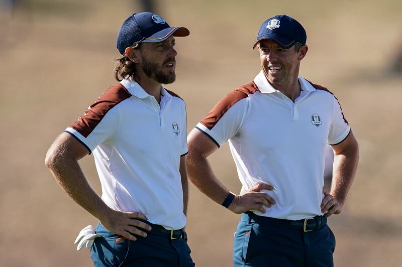 Rory McIlroy shares a laugh with foursomes partner Tommy Fleetwood during the second day of play at the Ryder Cup in Rome. Photograph: Matteo Ciambelli/Inpho